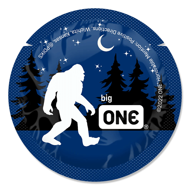 Circular sticker with a silhouette of Bigfoot, trees, and a night sky with stars and moon on a blue background.