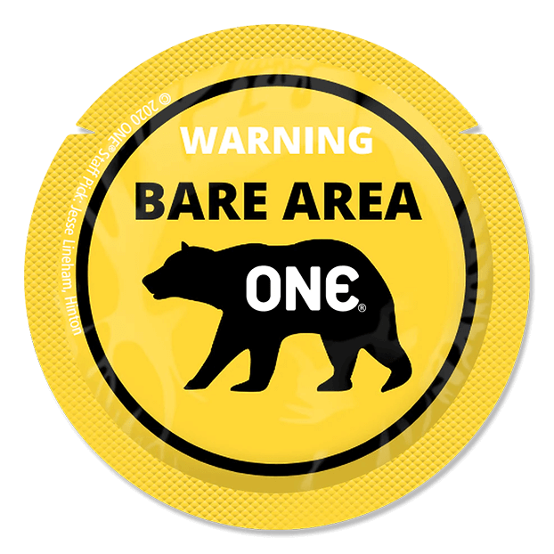 Round yellow warning label with a bear illustration and text on a black background