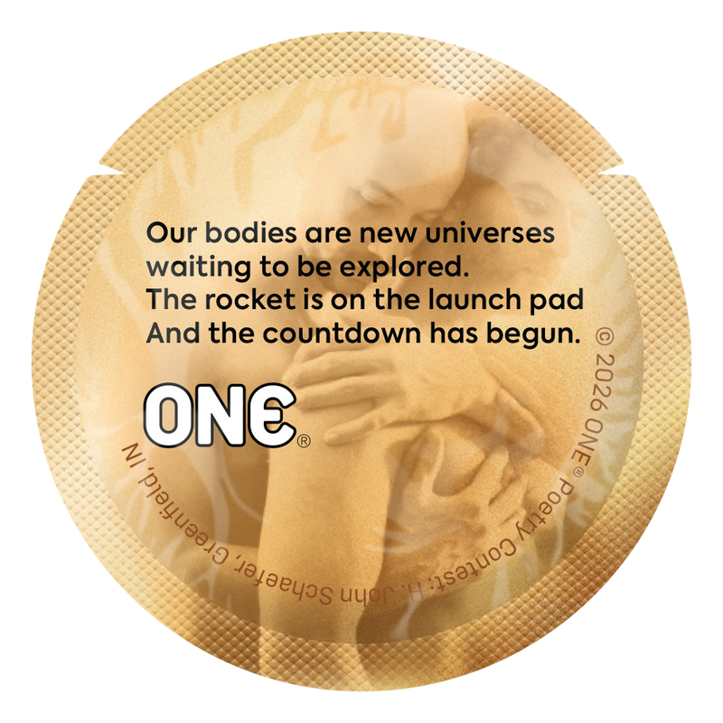 Gold condom wrapper with a poem comparing bodies to unexplored universes, emphasizing curiosity and intimacy.