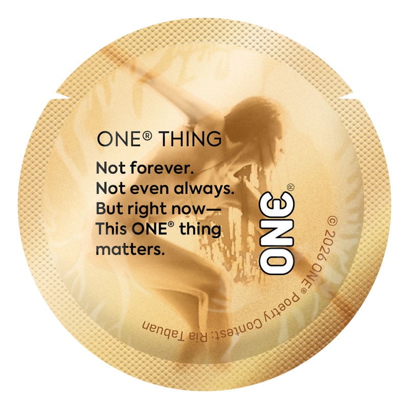 Gold condom wrapper featuring a short reflective poem about presence and intimacy in the moment.