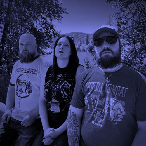 Image of Sorcia - a ONE on Stage band. Three people standing outdoors. B&W image with purple hue. 