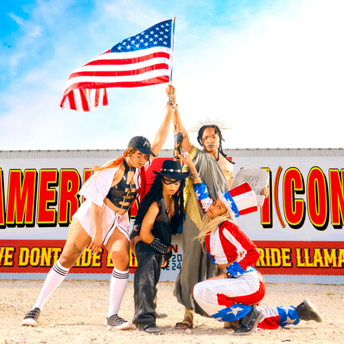 Image WDRL - a new ONE On Stage band. There are four people holding up an American flag. There is a white building behind them with red and white text on it. 