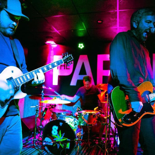 Image of War in Kids - a ONE on Stage band. Two people playing guitar, one person playing drums. 